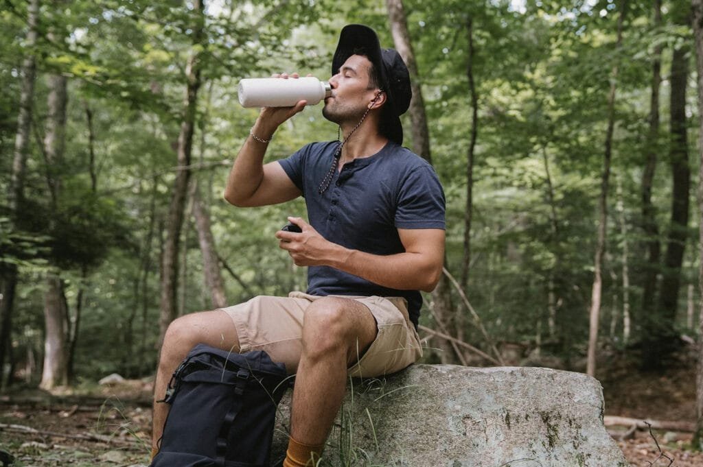 Man Drinking Water, Man in a Forest